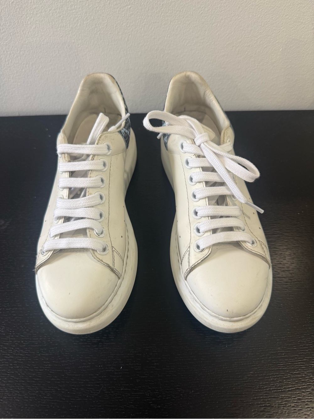 Alexander McQueen White Leather Sneakers with blue and black snake skin design.